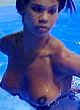 Charley Uchea topless in a pool & tits slip pics