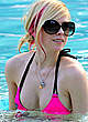 Avril Lavigne in pink bikini in the pool pics