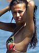 Giorgia Palmas sunbathes in bikini on a beach pics