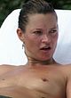 Kate Moss caught topless on a beach pics