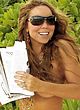 Mariah Carey nipslip and braless on a beach pics