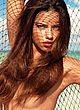 Adriana Lima posing all nude on a beach pics