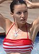 Dannii Minogue exposes big tits in wet bikini pics
