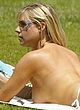 Abi Titmuss caught sunbathing topless pics