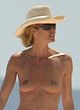 Elle Macpherson caught topless on a beach pics