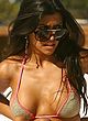 Kourtney Kardashian sunbathes in tight bikini pics