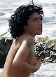 Amy Winehouse sunbathes topless on a beach pics