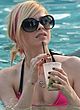 Avril Lavigne caught by paparazzi in bikini pics
