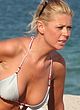 Tara Reid sunbathes in bikini on a beach pics