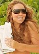 Mariah Carey caught topless on a beach pics