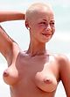 Amber Rose naked pics - shows off big breasts outdoors