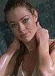Denise Richards flashes bare tits on a beach pics