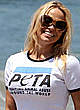 Pamela Anderson in shorts & tanktop on a beach pics