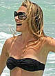 Molly Sims caught in bikini on the beach pics