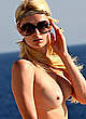 Paris Hilton naked pics - relaxing topless on the boat