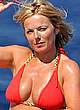 Geri Halliwell cleavage red bikini on a beach pics
