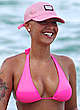 Amber Rose deep cleavage in pink bikini pics