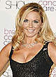 Geri Halliwell shows cleavage at fashion show pics