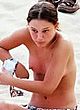 Natalie Portman sunbathes topless on a beach pics