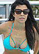 Kourtney Kardashian in blue bikini by the pool pics