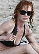 Marg Helgenberger in black bikini on the beach pics