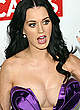 Katy Perry shows deep cleavage and pants pics
