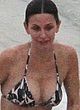 Courteney Cox tanning in bikini on a beach pics
