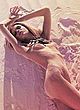 Erin Heatherton posing all nude on a beach pics