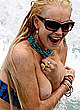 Lindsay Lohan boob out on the beach shots pics