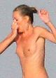 Kate Moss caught jumping topless pics