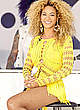 Beyonce Knowles in yellow dress on the stage pics