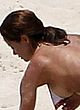 Brooke Burke flashes nude tits on a beach pics
