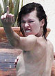 Milla Jovovich caught sunbathing topless pics
