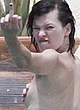 Milla Jovovich caught topless but covered pics