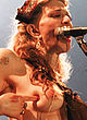 Courtney Love naked pics - flashes bare tits on a stage