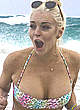 Lindsay Lohan shows cleavage and areola slip pics