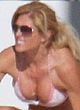 Torrie Wilson sunbathes in tight bikini pics