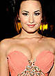 Demi Lovato shows cleavage in pink dress pics
