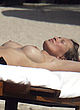Karen Mulder tanning topless on a beach pics