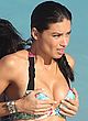 Adriana Lima squeezes her tits in bikini pics