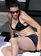 Kristin Davis tanning in black bikini pics