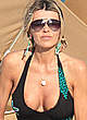 Rita Rusic shows cleavage on the beach pics