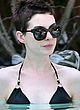 Anne Hathaway relaxing in bikini in a pool pics