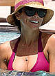 Brooke Burke wearing a bikini poolside pics pics