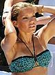 Sylvie Meis sunbathes in bikini in a pool pics