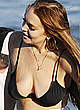 Lindsay Lohan shows cleavage in black bikini pics