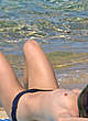 Vanessa Paradis sunbathing topless on a beach pics