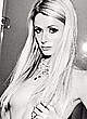 Paris Hilton posing topless but covered pics