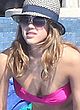 Jessica Alba sunbathes in bikini in a pool pics