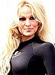 Pamela Anderson posing in black swimsuit pics